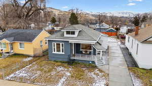 Bungalow-style house featuring a mountain view and covered porch