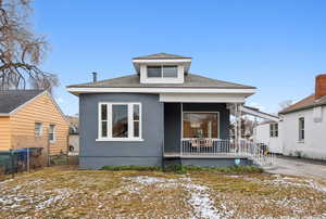 Bungalow featuring covered porch