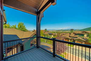 Wooden deck featuring a mountain view