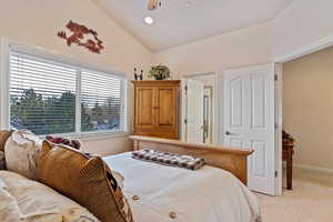 2 of 2 Primary Bedrooms featuring light carpet, ceiling fan, and lofted ceiling