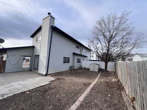 Back of property featuring a patio area