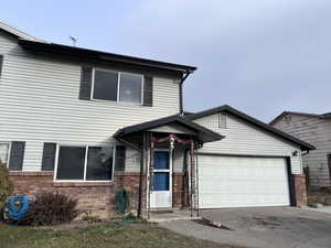 View of property featuring a garage