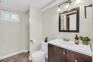 Bathroom with tile patterned floors, vanity, and toilet