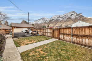 View of yard featuring a gazebo, an outdoor living space, a mountain view, and a patio