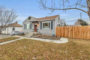 Bungalow-style home featuring a front yard