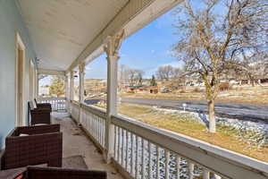 View of snow covered back of property