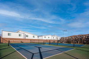 View of tennis/pickleball court with basketball court