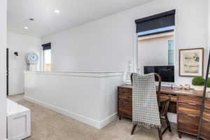 View of carpeted office/study area/reading nook