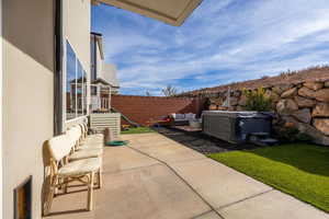 View of patio / terrace, hot tub and firepit