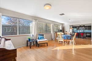 Dining area featuring a wealth of natural light and light hardwood / wood-style floors