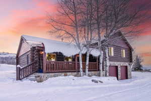 Cabin featuring a garage