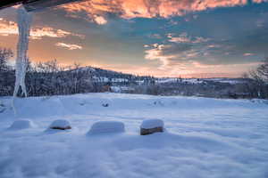 View of yard covered in snow