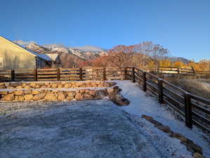 View of yard with a mountain view and a rural view