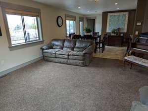 Living room featuring plenty of natural light and light carpet