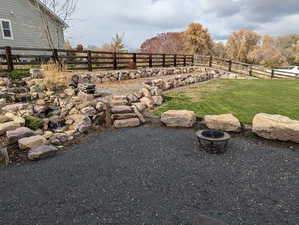 View of yard featuring a fire pit