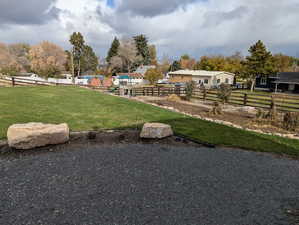 View of home's community with a yard and a playground