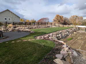 View of yard with a rural view