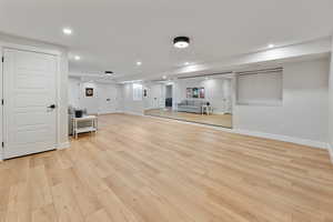 Unfurnished living room with light wood-type flooring