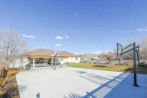 View of patio / terrace with basketball court and a trampoline