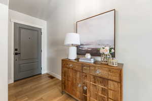 Foyer with light hardwood / wood-style floors