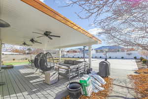 View of patio / terrace with ceiling fan, an outdoor hangout area, and a wooden deck