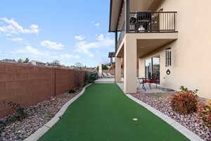 View of yard featuring a patio area and a balcony