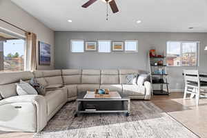 Living room featuring ceiling fan