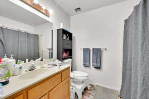 Bathroom with vanity and toilet