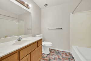 Full bathroom with vanity, shower / bathing tub combination, and toilet