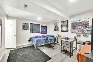 Bedroom featuring hardwood / wood-style floors