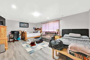 Bedroom with light wood-type flooring