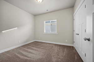 View of carpeted spare room