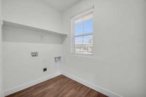 Washroom featuring washer hookup, electric dryer hookup, dark hardwood / wood-style floors, and a wealth of natural light