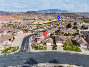 Birds eye view of property featuring a mountain view