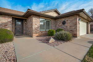 Doorway to property featuring a garage