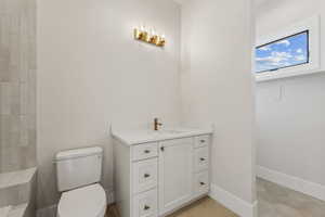 Bathroom with vanity and toilet