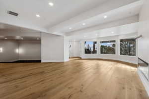 Basement Family room featuring light wood-type flooring and walk out