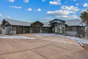 View of front of property featuring a garage