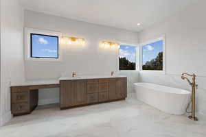 Master Bathroom featuring vanity and a Freestanding tub, double vanity and makeup drop down