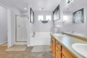 Primary Suite with Double vanity, jetted tub and stand up shower