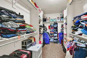 Walk in closet with tons of storage