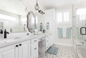 Bathroom with vanity and separate shower and tub