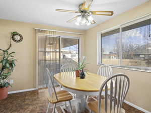 Dining area with ceiling fan