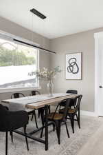 Dining room with light hardwood / wood-style floors