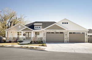 View of front facade featuring french doors and a garage