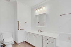 Bathroom with vanity, toilet