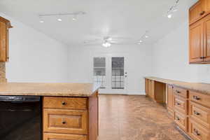 Kitchen with ceiling fan and black dishwasher