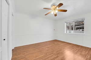 Main Bedroom with ceiling fan, and wood-style flooring