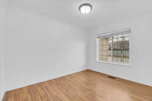 Empty room with wood-style floors