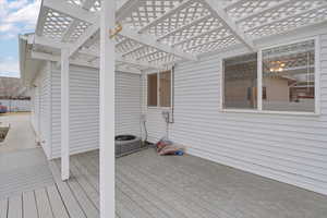 Deck with a pergola and cooling unit